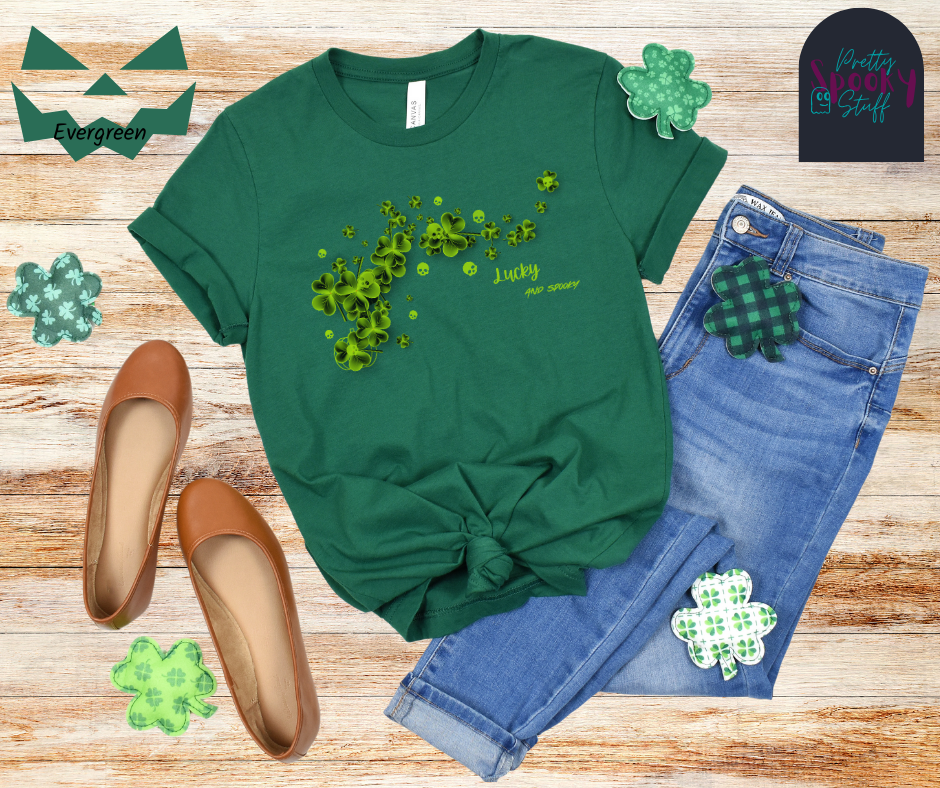 St. Patrick's Day shirt with green clovers and green skulls around them and on top of them with the words "lucky and spooky" below, in evergreen.