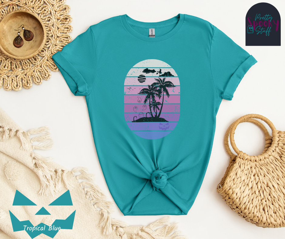 Summerween shirt with oval purple gradient lines, behind small beach and palm trees silhouette, that also has three gravestones on the beach with several ghosts flying above, as well as a witch flying on her broom in the clouds, in tropical blue.