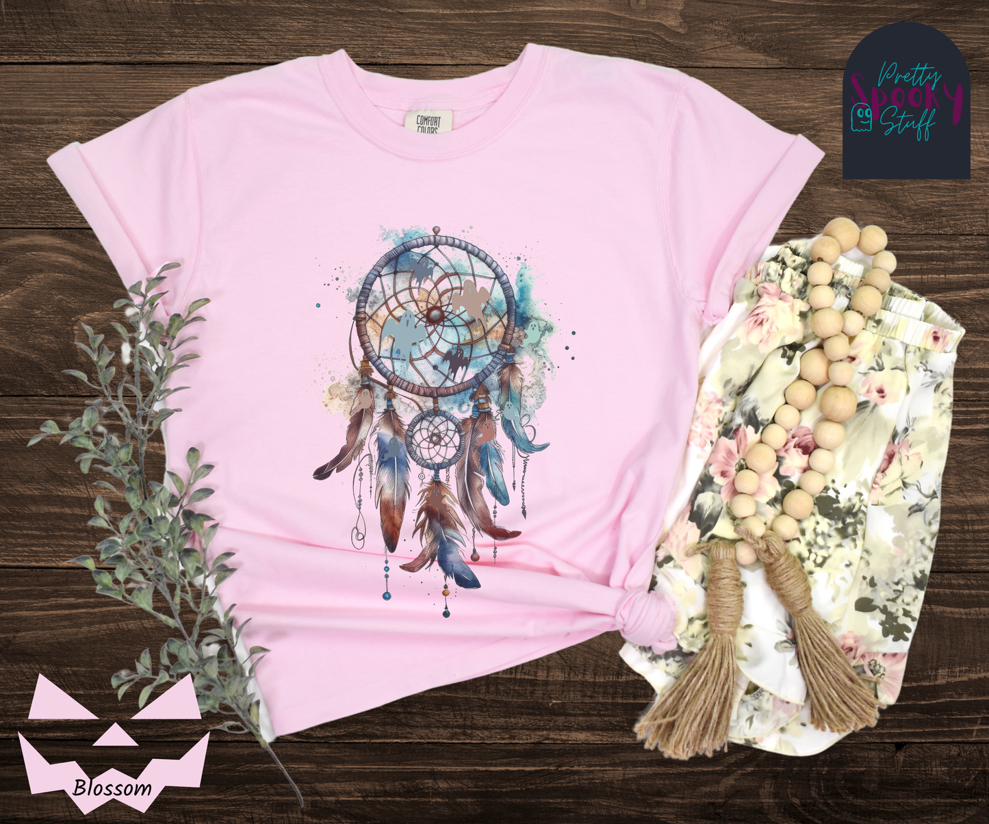 Halloween ghost dreamcatcher, watercolor aesthetic with blues and browns, with 4 ghost silhouettes in the main circle, and more ghosts hidden in the 5 feathers hanging below, in blossom.