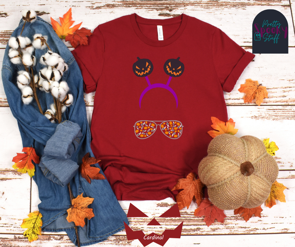 Aviators Halloween shirt with purple headband with creepy jack o' lanterns springing from the top, and aviator glasses with small pumpkins and ghosts filling the lenses, in cardinal.