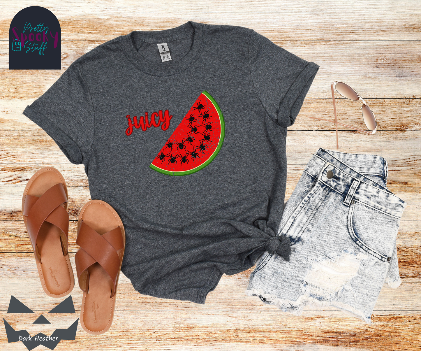 Summer watermelon shirt with a slice of watermelon where black spiders replace seeds, and the word "juicy" in red cursive font, vintage look, in dark heather.