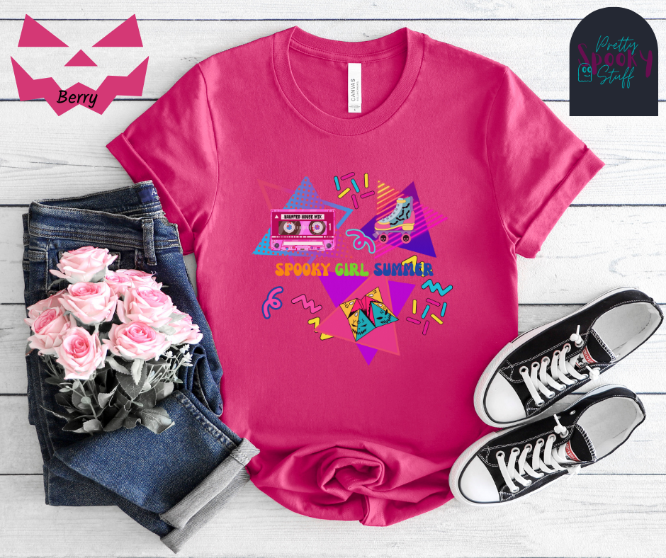 Summerween unisex tee featuring retro 90's design including cassette tape with "haunted house mix", bat covered roller skate, folded paper fortune teller, bright-colored squiggles, and words "spooky girl summer" across the middle in orange, green, and dark blue, in berry.