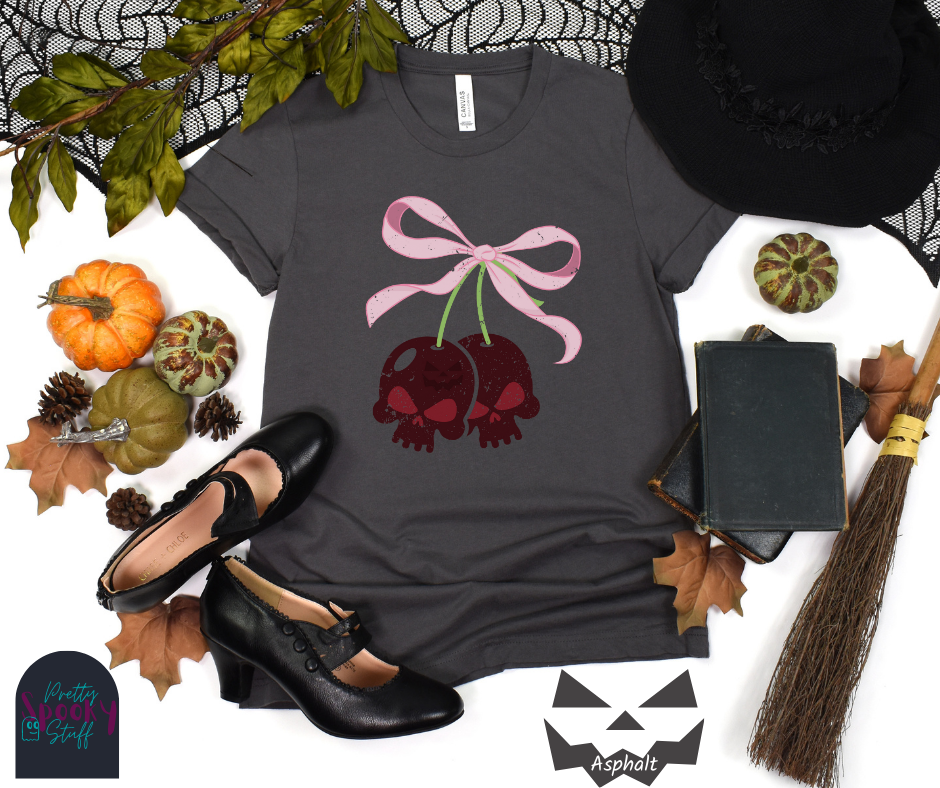Halloween coquette shirt with a pair of cherries shaped as skulls, with a light pink bow tying them together, vintage look, in asphalt.
