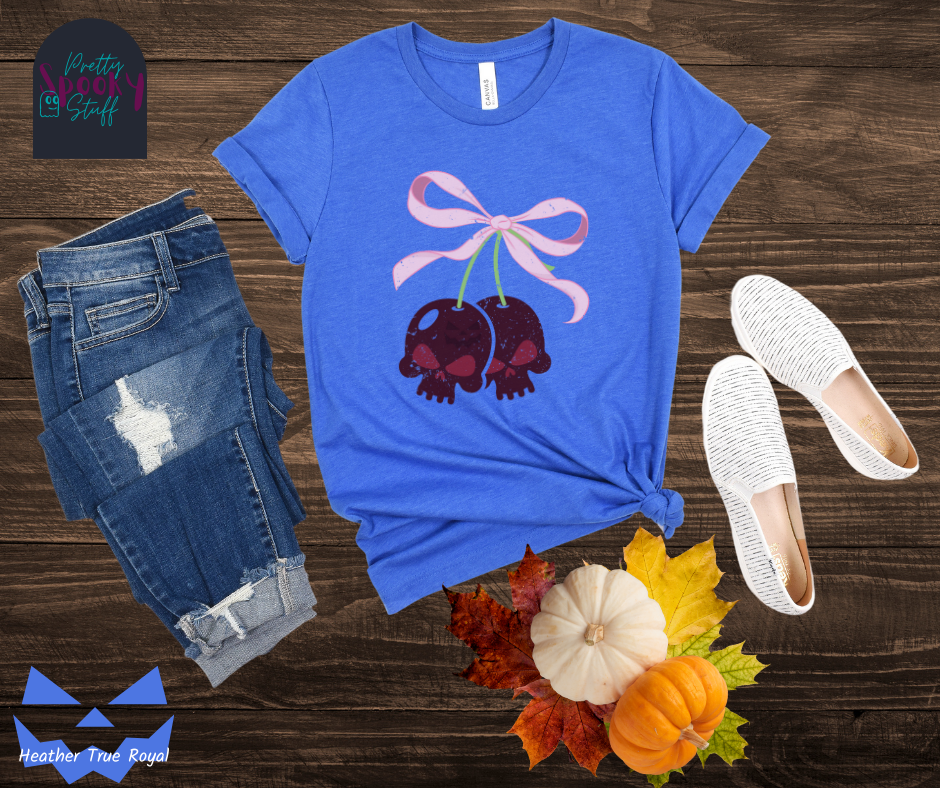 Halloween coquette shirt with a pair of cherries shaped as skulls, with a light pink bow tying them together, vintage look, in heather true royal.