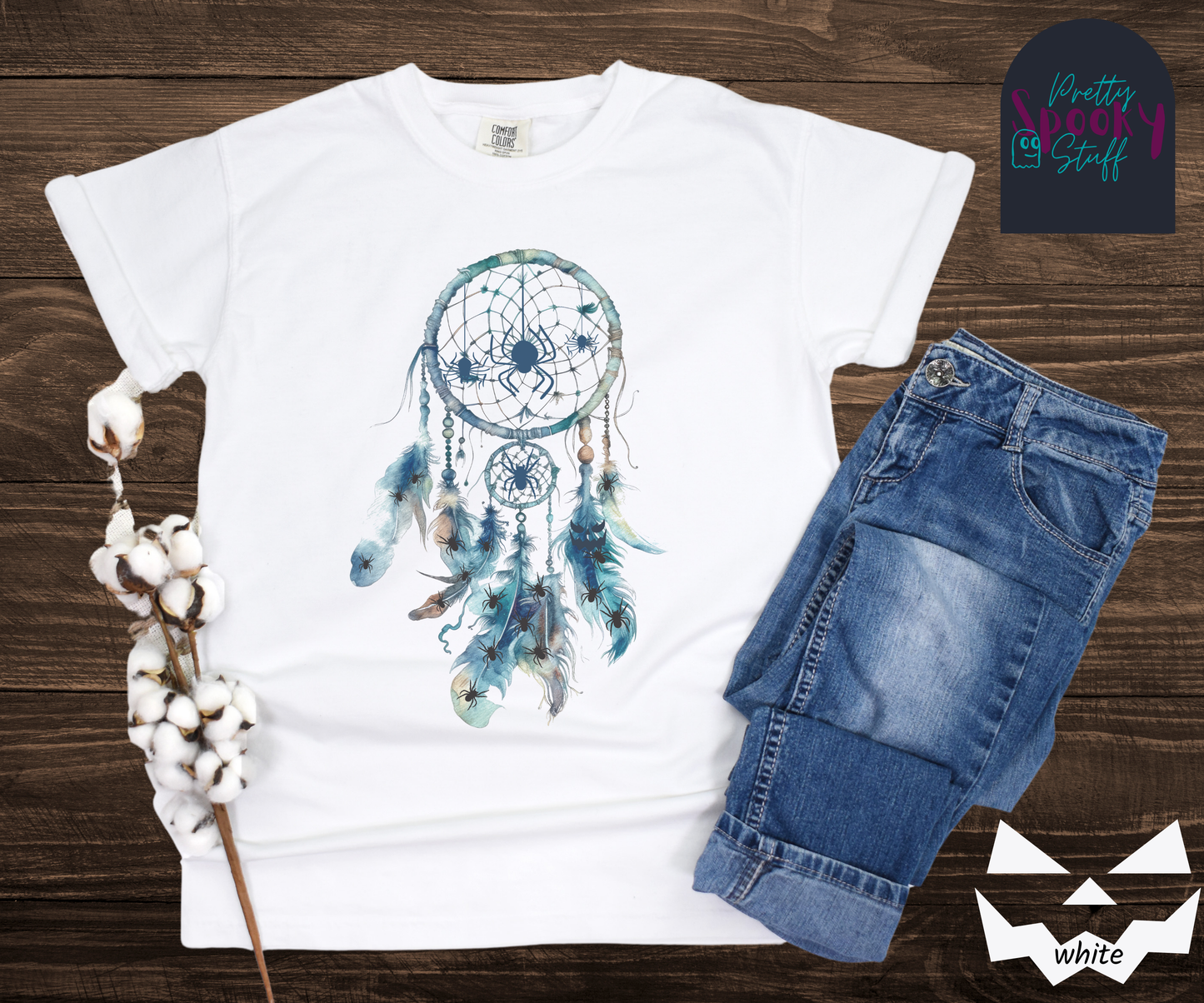 Halloween spider dreamcatcher shirt, watercolor aesthetic in shades of blue, a few spiders hanging in the main circle, several other spiders hiding in the multiple feathers hanging below, in white.