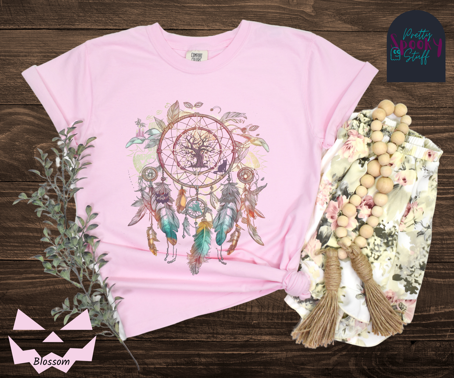 Halloween spooky dreamcatcher shirt watercolor aesthetic in teal, purples, and pinks, with purple tree and cat in the main circle, other spooky details hidden in the feathers hanging below, in blossom.