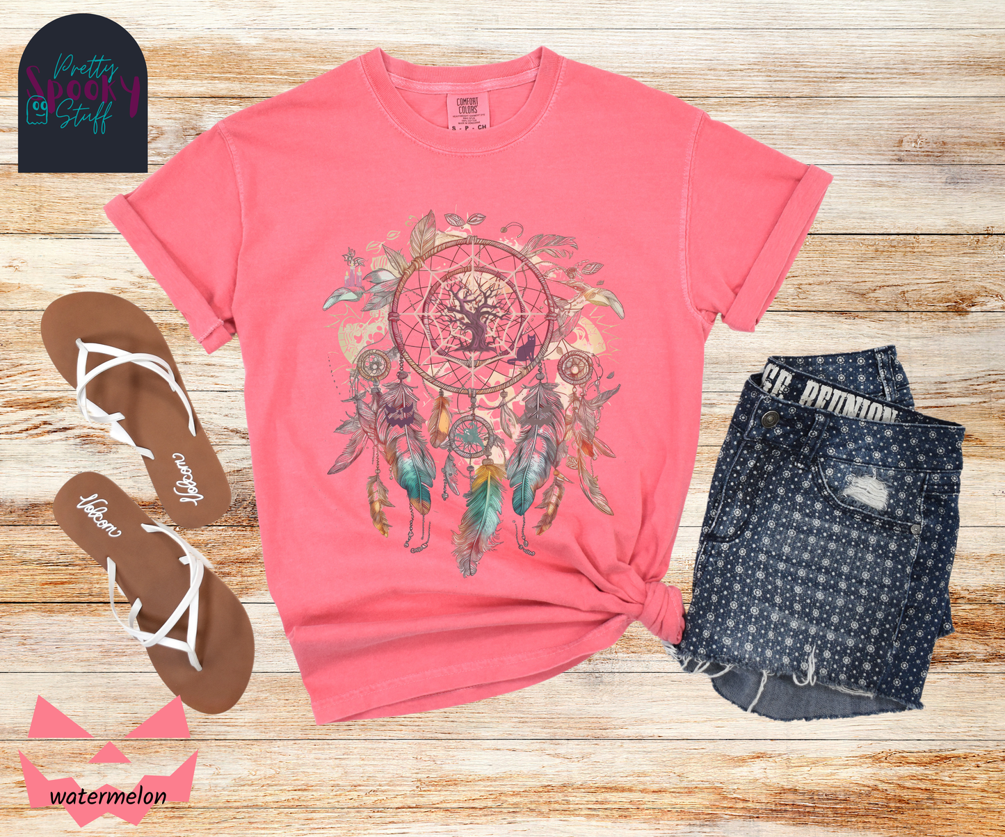 Halloween spooky dreamcatcher shirt watercolor aesthetic in teal, purples, and pinks, with purple tree and cat in the main circle, other spooky details hidden in the feathers hanging below, in watermelon.