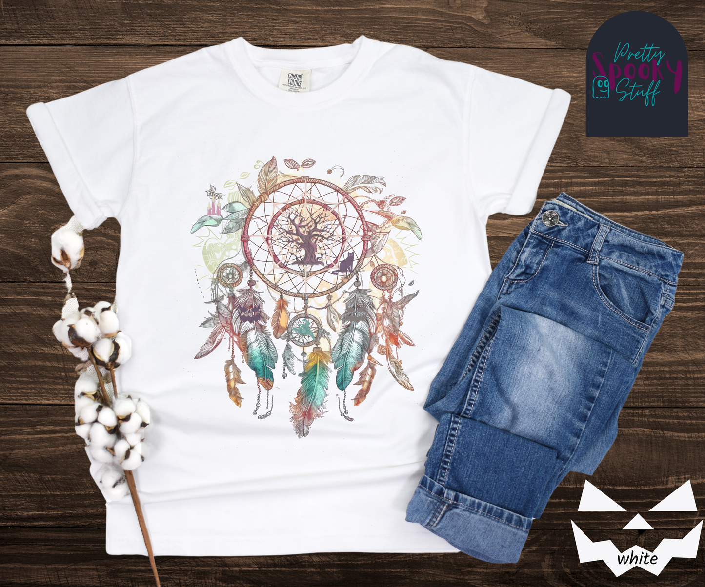 Halloween spooky dreamcatcher shirt watercolor aesthetic in teal, purples, and pinks, with purple tree and cat in the main circle, other spooky details hidden in the feathers hanging below, in white.