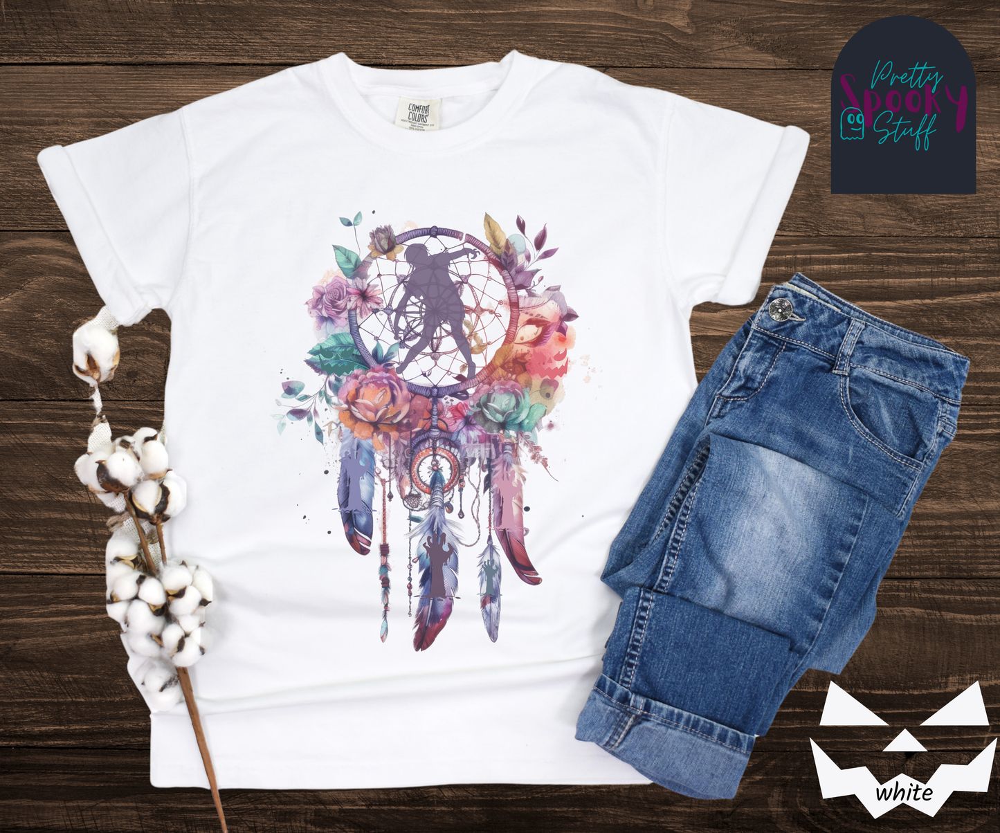 Zombie Halloween dreamcatcher shirt, watercolor aesthetic in purples, pinks, and teals, with purple zombie silhouette in the main circle, and zombie arm silhouettes hidden in the 3 feathers hanging below, in white.