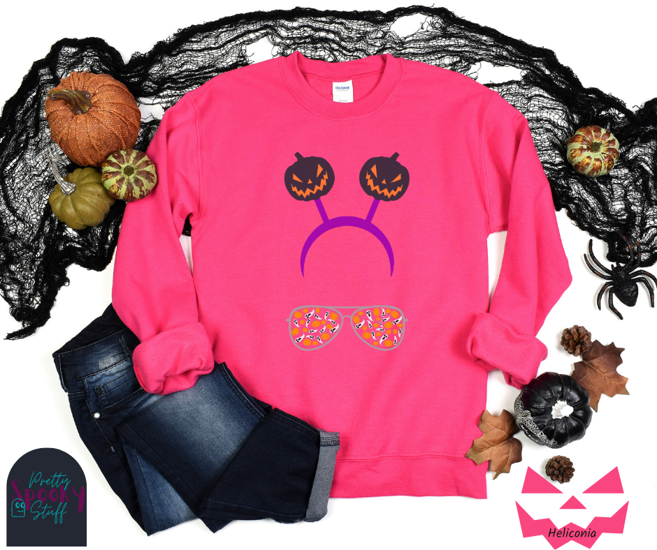 Halloween sweatshirt with aviator sunglasses filled with pumpkins and ghosts, and a purple headband with creepy jack o' lanterns, in heliconia.