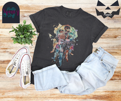 Gravestone dream catcher shirt, watercolor aesthetic dream catcher with blues, pinks and purples, 5 feathers hanging blow, mauve gravestones in main circle, and crescent moons hidden in feathers, in pepper.