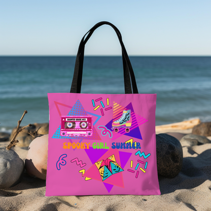 90's Style Summerween tote bag, magenta pink background with pink cassette tape with the words "haunted house mix" on it, rollerskate with bats, and skulls on the wheels, folded paper fortune teller, squiggles, and the words "spooky girl summer" across the middle in orange. green, and dark blue. Sitting on a beach.