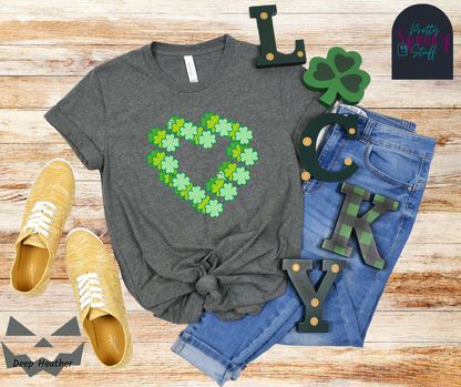 St. Patrick's Day shirt with three hearts made from four-leaf clovers, each in a different shade of green, offset from each other with ghosts hiding amongst them in shades of green, in deep heather.