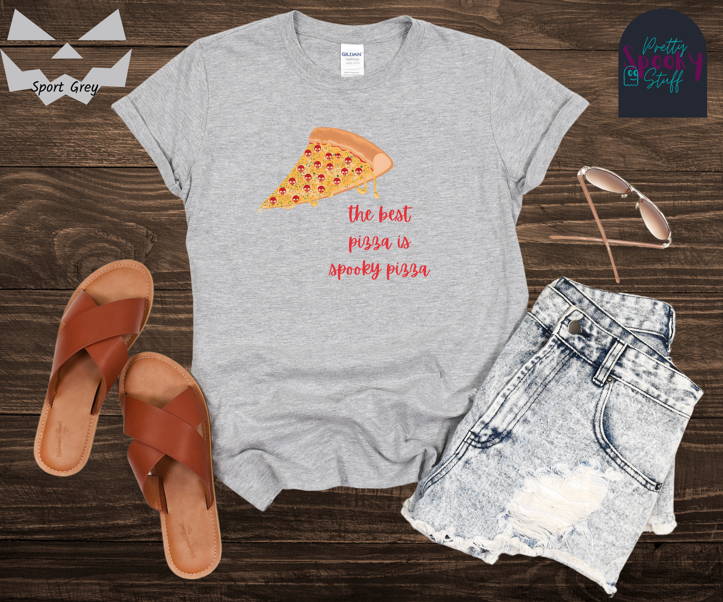 Pizza shirt with a slice of pepperoni pizza with skull shaped pepperonis and the words "the best pizza is spooky pizza" in red cursive font, in sport grey.