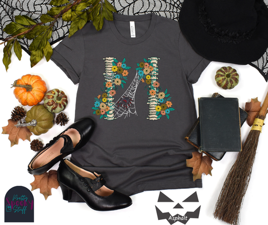 Spider Halloween shirt with two spine bones wrapped in vintage flowers, and a tarantula spider on a web between the two, in asphalt.